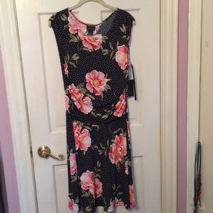 Dress. Floral and polka dot patterned, above knee